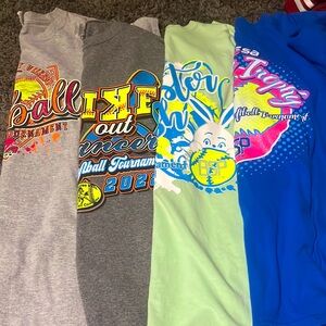 Four softball tournament shirts